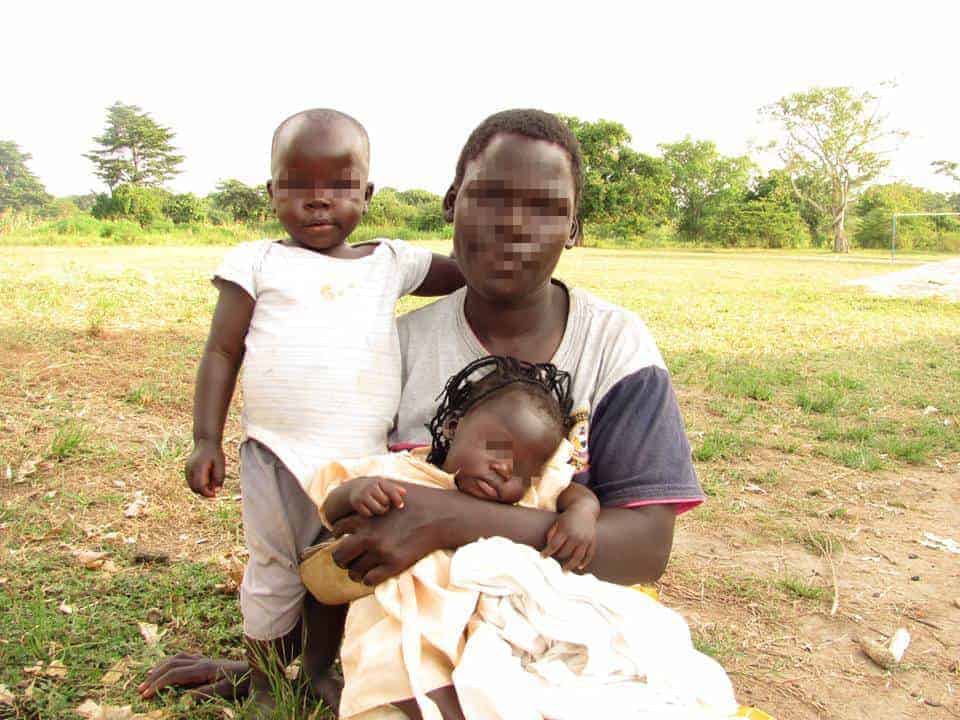 Ugandan Women with her daughters (blurred faces)